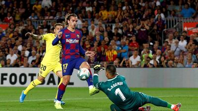 Barcelona's Antoine Griezmann in action with Villarreal's Sergio Asenjo. Reuters