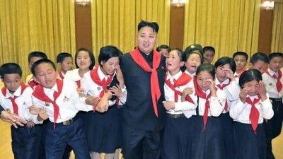 Kim Jong-un, the North Korean leader, walks surrounded by 'weeping' members of the Korean Children's Union (KCU).
