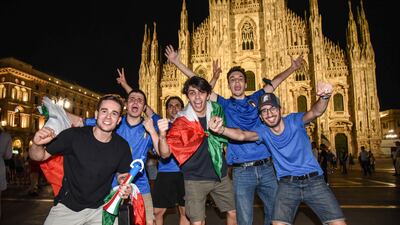 Italy fans celebrate their team's victory in the Euro 2020 semi-final against Spain in Milan, Italy.