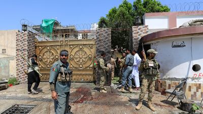 Afghan security forces stand outside the home of MP Zahir Qader, where two people were killed in a suicide attack, in Jalalabad on August 30, 2017. Parwiz / Reuters