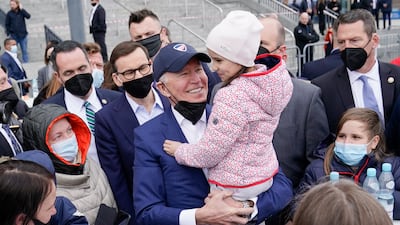 US President Joe Biden meets Ukrainian refugees at the PGE Narodowy Stadium in Warsaw during a visit to Poland. AP