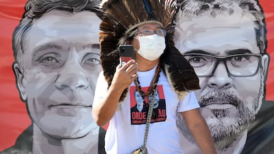 Images of Dom Phillips, left, and Bruno Pereira at a rally held by indigenous Brazilian activists. AFP