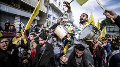 Supporters of the Palestinian Fatah attend a rally marking the 55th anniversary of the political party in central Gaza City. EPA