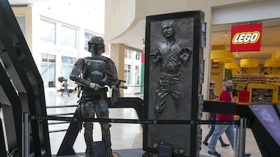 Boba Fett and Han Solo in carbonate at the Star Wars display ahead of the Star Wars UAE premiere on December 17 in Yas Mall. Mona Al Marzooqi / The National