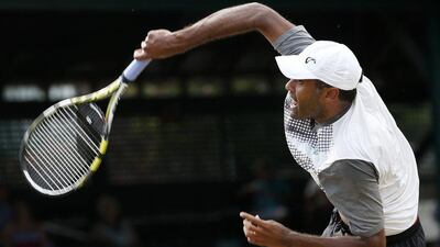 Rajeev Ram serves against Ivo Karlovic during his win in the ATP Newport final on Sunday in the US. Michael Dwyer / AP / July 19, 2015