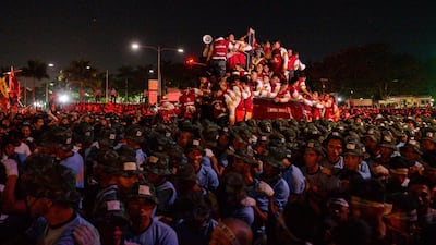 Thousands of devotees and policemen pull the carriage with the statue of the Black Nazarene at the start of the annual religious procession in Manila. AFP