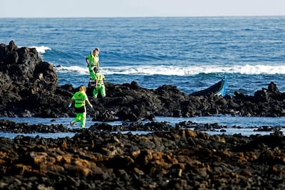 Rescue workers search for bodies after a migrant boat capsized near the Canary Island of Lanzarote. Reuters