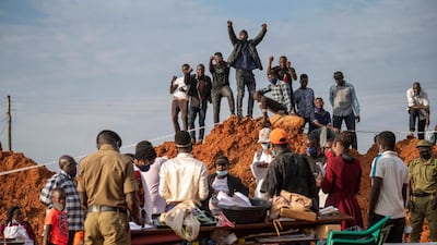 Supporters of Ugandan presidential candidate Bobi Wine cheer as election officials count votes in Kampala after polling closed on January 14, 2021. AP Photo
