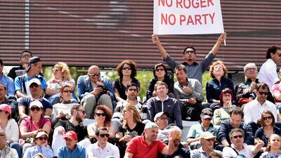 A Roger Federer supporter shows a banner during his match at the Italian Open. Dennis Grombkowski / Getty Images