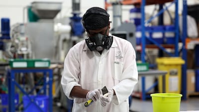 Staff at Camel Soap in Dubai clean each bar of soap
