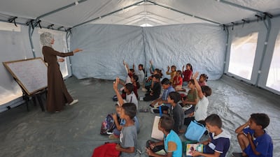 Palestinian pupils attend a drawing class in Khan Yunis, in the southern Gaza Strip on October 7. AFP