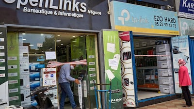 A man uses a foot pedal in an electronics store in Casablanca, Morocco. AP Photo