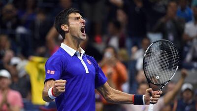 Novak Djokovic of Serbia reacts after winning a game against Roger Federer of Switzerland during their 2015 US Open Men's singles final match at the USTA Billie Jean King National Tennis Center in New York on September 13, 2015. AFP PHOTO/JEWEL SAMAD