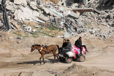 Palestinians transport their belongings on a donkey-drawn cart as they take Saftawi street towards the north in Jabalia in the northern Gaza Strip. AFP