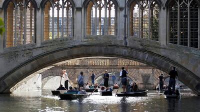 People are seen punting on the River Cam near the Bridge of Sighs at St John's College, University of Cambridge, Britain, October 28, 2011. Reuters/Suzanne Plunkett