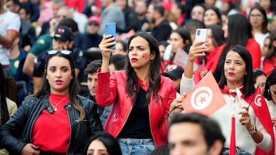 Tunisia soccer fans gather to watch their national team play against Denmark in a World Cup soccer match played in Qatar, on a large screen set up for fans in Tunis, Tunisia, Tuesday, Nov. 22, 2022. (AP Photo / Hassene Dridi)