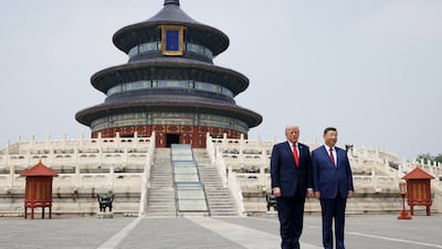 Donald Trump and Xi Jinping pose for photos during their visit to the Temple of Heaven in Beijing. Getty Images