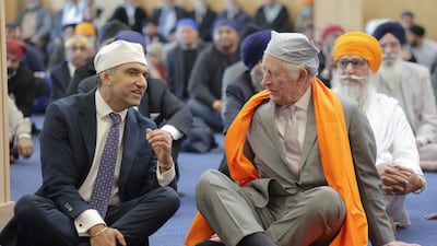 King Charles III in the Prayer Hall with Prof Gurch Randhawa, a member of the Sikh congregation, on a visit to the newly built Guru Nanak Gurdwara in Luton on Tuesday. PA