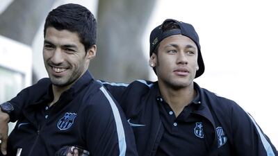 Luis Suarez, left, and Neymar arrive for training. Kiyoshi Ota / EPA