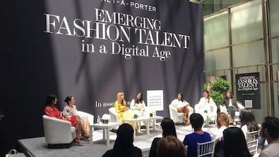 Lisa Aiken, in yellow, the retail fashion director at Net-a-porter at a talk in Dubai. Courtesy Net-a-porter