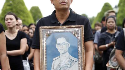 Thai mourners line up to sign condolence books to pay their respects to the late Thai King Bhumibol Adulyadej outside the Grand Palace in Bangkok. Rungroj Yongrit / EPA