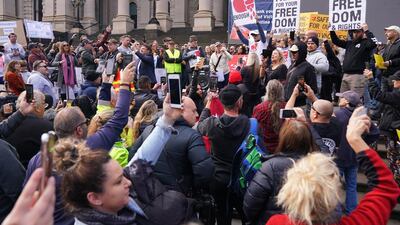 Protesters gather outside Parliament House in Melbourne, Australia. Anti-vaxxers and people fed up with the coronavirus lockdown have broken social distancing rules to protest in Melbourne on Mother's Day. EPA