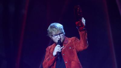 Ed Sheeran accepts the award for global success. REUTERS/Hannah McKay