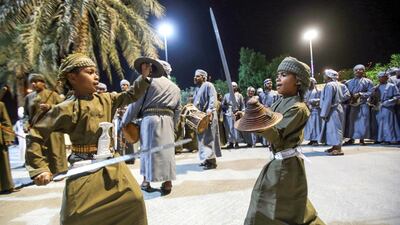 Omani children perform a traditional sword dance during the Muscat festival. AFP