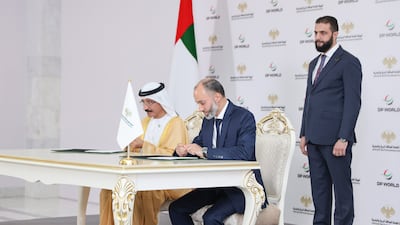 Syrian President Ahmad Al Shara watches as DP World group chairman Sultan bin Sulayem and Qutaiba Badawi, chairman of Syria's General Authority for Land and Sea Ports, sign the agreement for Tartus Port. Presidency of the Syrian Arab Republic