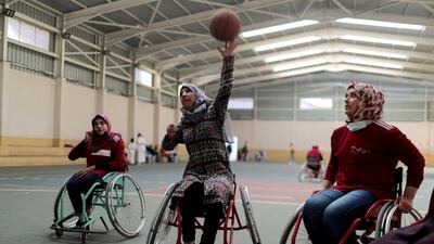 Disabled Palestinian women participate in a local basketball competition for people with disabilities in Gaza City. REUTERS
