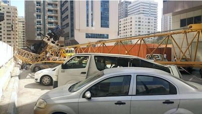 A crane crushed several cars in the Tourist Club area when it collapsed. Photo Courtesy: Abu Dhabi Police
