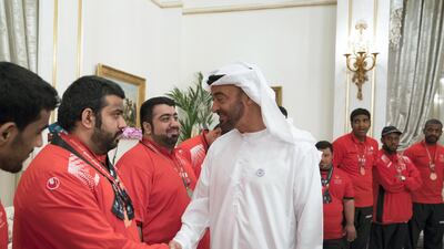 Sheikh Mohammed bin Zayed, Crown Prince of Abu Dhabi and Deputy Supreme Commander of the UAE Armed Forces (R), greets a member of the UAE Special Olympics team, during a Sea Palace barza. Mohamed Al Hammadi / Crown Prince Court - Abu Dhabi