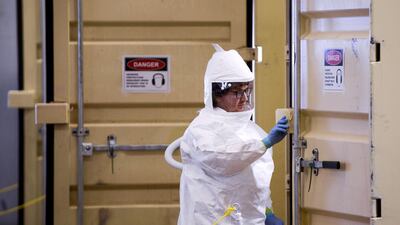 A technician prepares to walk into a decontamination unit in Brighton, Colorado, US. AFP