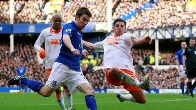 Everton's Seamus Coleman vies for the ball against Blackpool's Robert Harris at Goodison Park.