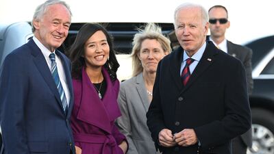 Mr Biden is greeted by Ed Markey, a Massachusetts senator, and Boston Mayor Michelle Wu on arrival at Boston Logan International Airport. AFP