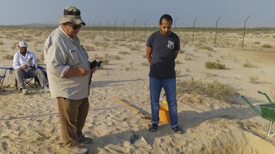 Ahmed Al Haj and Dr Mark Beech, both from Abu Dhabi Tourism and Culture Authority and Fadhl Al Eryani, an NYUAD student, at a dig on Saadiyat. Investigations have unearthed evidence of settlements from the 18th and 19th century. Courtesy Dr Robert Parthesius