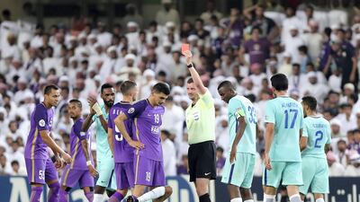 Al Ain's Mohnad Salem is sent off during the first leg of their Asian Champions League quarter-final against Al Hilal at Hazza bin Zayed Stadium. Chris Whiteoak / The National