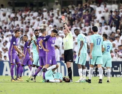Al Ain's Mohanad Salem, centre left, is sent off against Al Hilal. Chris Whiteoak / The National