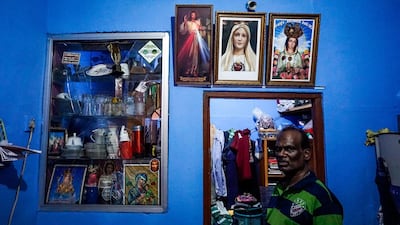 Alosias Peter, a 58-year-old flight ticket salesman, next to damaged glass in his home following a controlled explosion in Colombo, Sri Lanka, April 22, 2019. Jack Moore / The National.