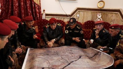 Lieutenant General Talib Shaghati, (centre) inspect a map with officers in Al Zuhoor neighborhood during a fight with Islamic State in Mosul, Iraq, January 7, 2017. REUTERS/Ahmed Saad