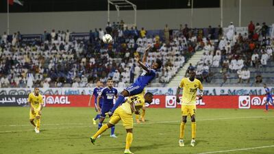 Fahad Salim Hadeed, centre top, of Al Nasr collides with Al Wasl's Ganim Ahmed Basheer during their Arabian Gulf League match in Dubai on September 30, 2014. Antonie Robertson / The National