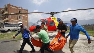 The body of Dutch climber Eric Arnold is moved to an ambulance in Kathmandu, Nepal, on May 26, 2016, after being retrieved from Mount Everest. Narendra Shrestha / EPA