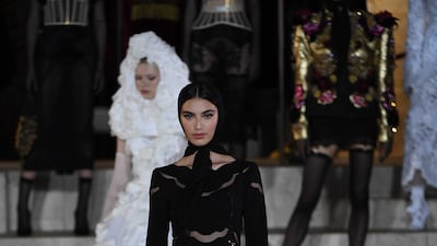 Saudi model Amira Al Zuhair walked the runway in a calf-length black dress.