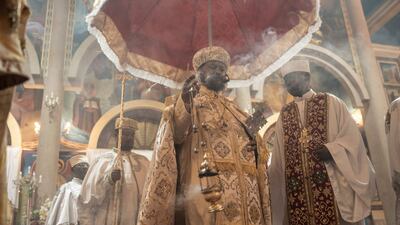 An Ethiopian Orthodox priest spreads incense while conducting a church service during the celebration of Easter at the Bole Medhanialem Church in Addis Ababa. AFP