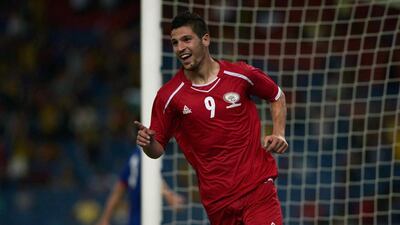 Tamer Seyam of Palestine celebrates his goal against Malaysia during their match in Kuala Lumpur on Tuesday. Mohd Rasfan / AFP
