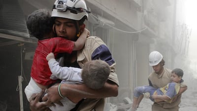White Helmets rescue children in Aleppo after what activists said was an air strike by regime forces in Aleppo. Sultan Kitaz / Reuters
