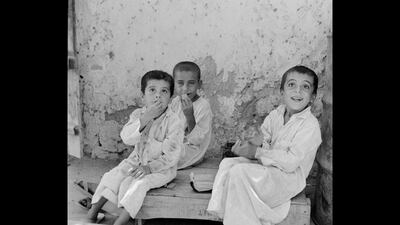 Children play in Abu Dhabi souk shot by photographer Guy Gravett in 1962.