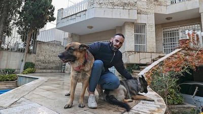 A man poses for a picture with his dogs near his house in Iran's capital Tehran. A proposed law in Iran from ultraconservative lawmakers aims to ban pets. All photos: AFP