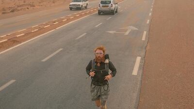 The journey covers 16,000km and has taken Cook, seen here in Algeria, more than 350 days to complete. Photo: Russ Cook