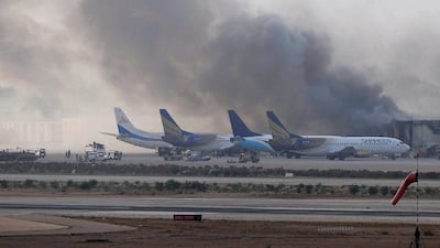 Smoke rises after militants launched an early morning assault at Jinnah International Airport in Karachi on June 9, 2014. Pakistan's security forces said the siege left at least 24 dead. Rizwan Tabassum/AFP Photo